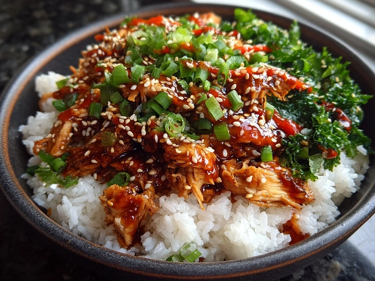 Final plated Honey Sriracha Chicken Rice Bowls with greens and sesame seeds