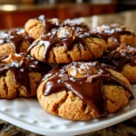 Home cook, taken with iPhone 14. Close-up slight angle of freshly prepared Peanut Butter Blossoms on white plate. Mouthwatering --ar 4:3 --style raw --s 245